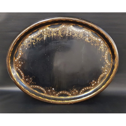 332 - LARGE EDWARDIAN PAPIER MACHE TRAY
of oval form with a black lacquer ground with gilt highlights and ... 