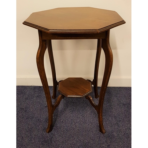 519 - EDWARDIAN OAK WINDOW TABLE
with an octagonal top, standing on four shaped supports united by an unde... 