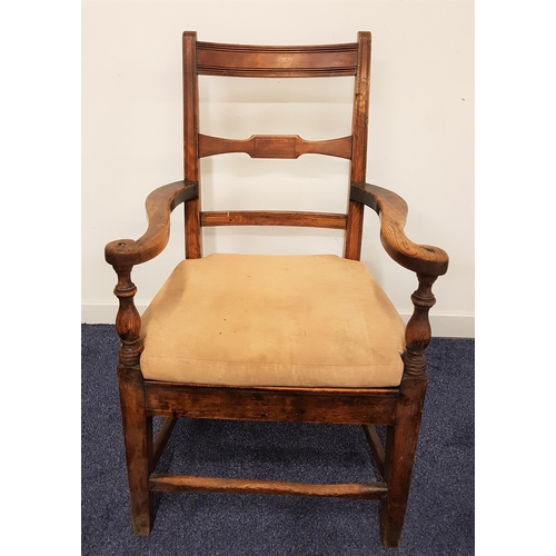 572 - LATE 19th CENTURY ELM ARMCHAIR
with shaped arms above a solid seat with a fitted cushion, standing o... 