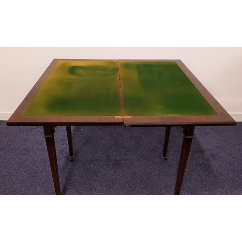 595 - EDWARDIAN MAHOGANY AND INLAID CARD TABLE
with a rotating fold over baize lined top above two frieze ... 