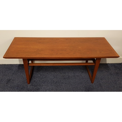 602 - TEAK OCCASIONAL TABLE
with a rectangular top standing on tapering loop supports united by a slatted ... 