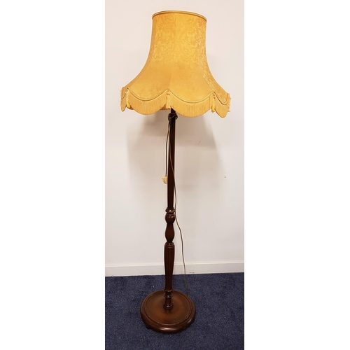 603 - STAINED OAK STANDARD LAMP
raise on a circular base with a turned column, 172cm high