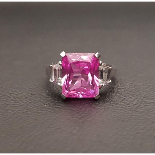 65 - PINK AND WHITE SAPPHIRE DRESS RING
the large radiant cut pink sapphire measuring approximately 10.7m... 