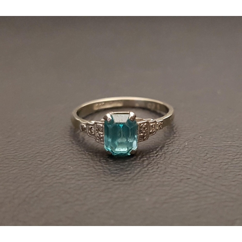 101 - EARLY 20th CENTURY BLUE TOPAZ AND DIAMOND RING
the central topaz approximately 0.75cts flanked by di... 