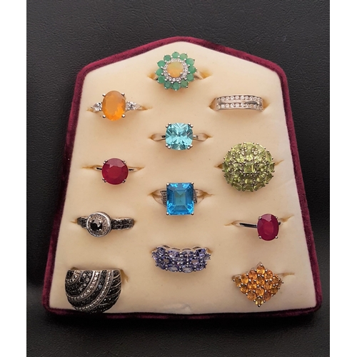 102 - SELECTION OF TWELVE GEM SET SILVER RINGS
of various sizes and designs, including blue topaz, opal, p... 