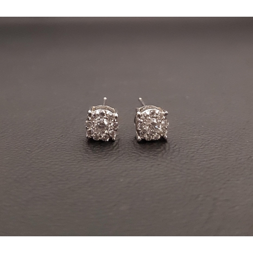 111 - PAIR OF DIAMOND CLUSTER STUD EARRINGS
the diamonds on each totalling approximately 0.3cts (0.6cts in... 