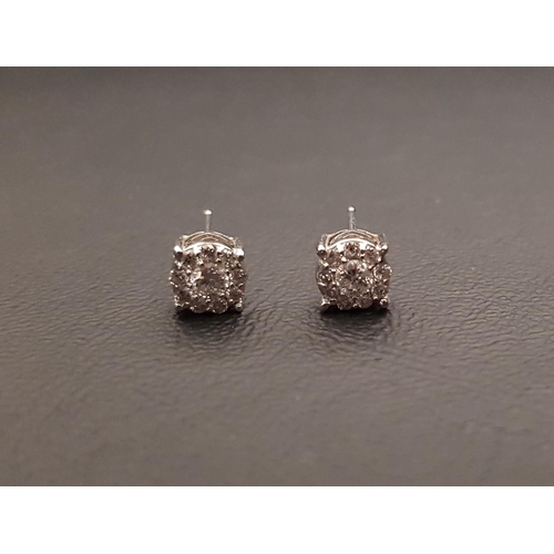 111 - PAIR OF DIAMOND CLUSTER STUD EARRINGS
the diamonds on each totalling approximately 0.3cts (0.6cts in... 