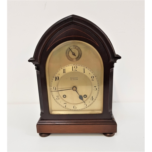 389 - EARLY 20th CENTURY MAHOGANY BRACKET CLOCK
in an arched case with a shaped silvered dial marked 'Edwa... 