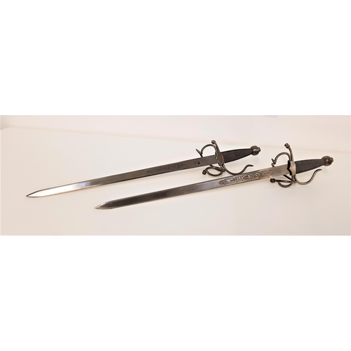 462 - PAIR OF SPANISH STYLE DUELING SWORDS
of steel construction with engraved 43.5cm long blades with wir... 