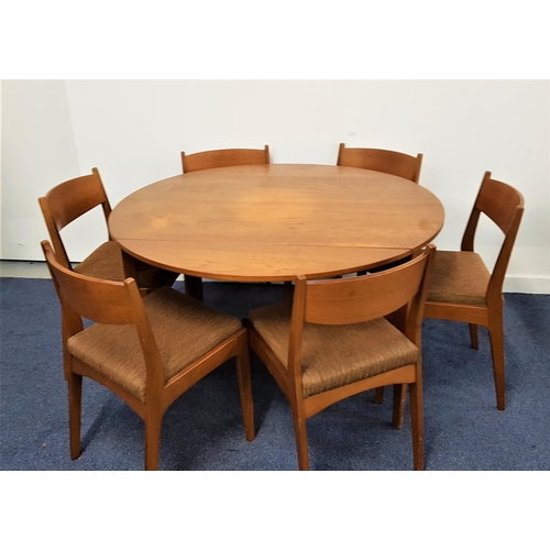 524 - HUNTER & GIBBS TEAK DINING TABLE AND CHAIRS
the table with a shaped drop flap, standing on tapering ... 