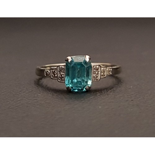 101 - EARLY 20th CENTURY BLUE TOPAZ AND DIAMOND RING
the central topaz approximately 0.75cts flanked by di... 