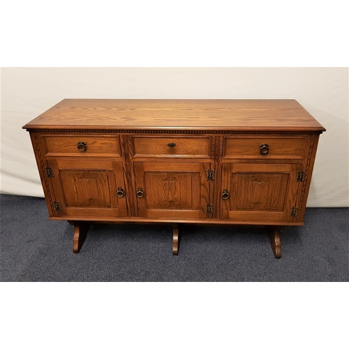 534 - JAYCEE OAK SIDEBOARD
with a moulded top above three panelled frieze drawers and three carved linen f... 