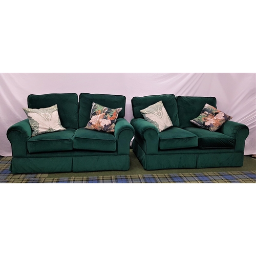 538 - PAIR OF SOFAS
each with two seats and scroll arms with loose seat and back cushions, covered in an e... 