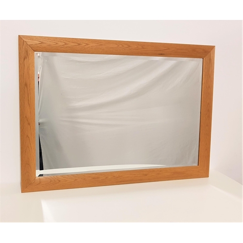 539 - LIGHT OAK CUSHION FRAME WALL MIRROR
with a bevelled plate, 73.5cm x 104.5cm