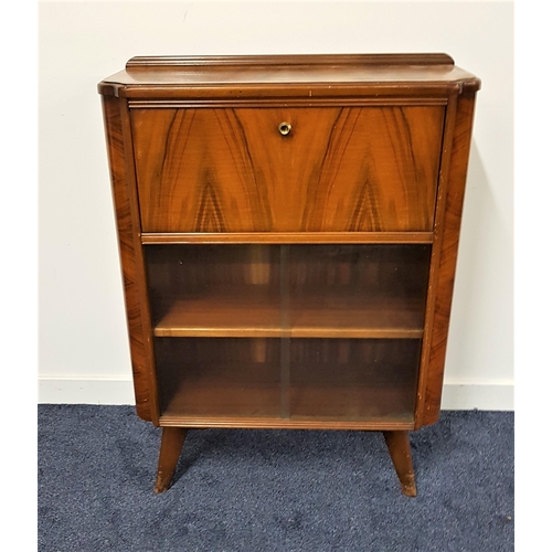 559 - HOMEWORTHY WALNUT BUREAU CABINET
with a raised back above a fall flap with a pair of glass sliding d... 