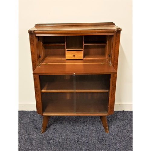 559 - HOMEWORTHY WALNUT BUREAU CABINET
with a raised back above a fall flap with a pair of glass sliding d... 