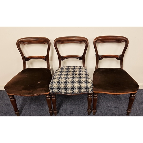 570 - THREE VICTORIAN MAHOGANY BALLOON BACK CHAIRS
with stuffover seats, standing on turned front supports... 