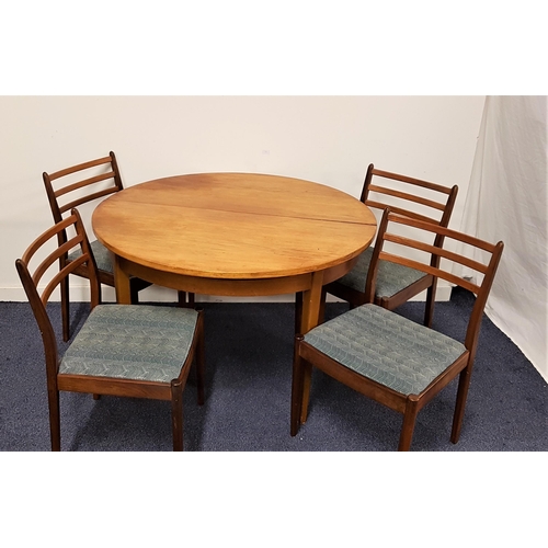 585 - TEAK CIRCULAR EXTENDING DINING TABLE WITH CHAIRS
the table with a pull apart top and fold out leaf, ... 