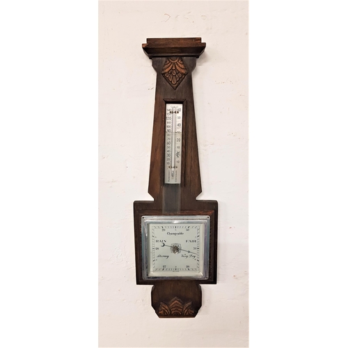 628 - OAK CASED ANEROID BAROMETER
with a thermometer on a silverd scale above a square silvered dial, 57.5... 