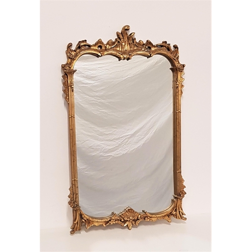 644 - ORNATE GILTWOOD WALL MIRROR
in a shaped frame, 106cm x 66cm