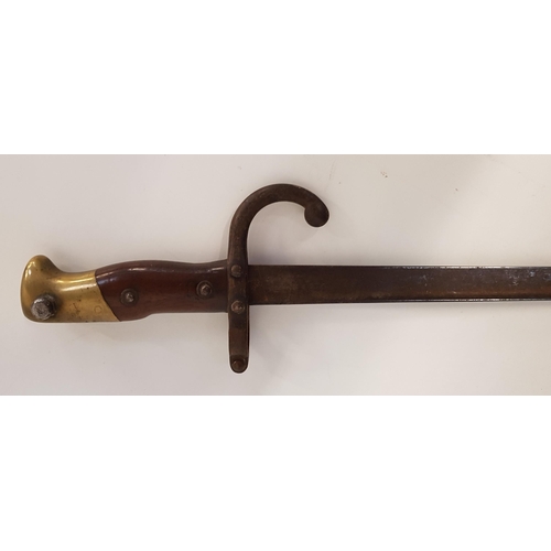 472 - FRENCH 1874 PATTERN GRAS BAYONET
with a 51.5cm long blade and a two piece wood grip with a brass pom... 