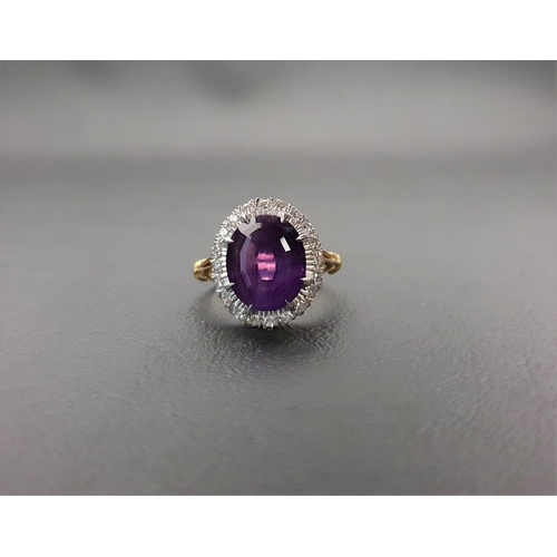 54 - AMETHYST AND DIAMOND CLUSTER RING
the large central oval cut amethyst measuring approximately 11.7mm... 