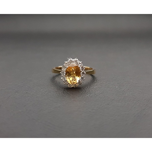 98 - CITRINE AND DIAMOND CLUSTER RING
the central oval cut citrine approximately 1.1cts in fourteen diamo... 