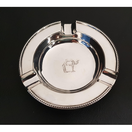 258 - GEORGE VI CIRCULAR SILVER ASHTRAY
decorated with a camel, Birmingham 1943, 50g/1.76oz, together with... 