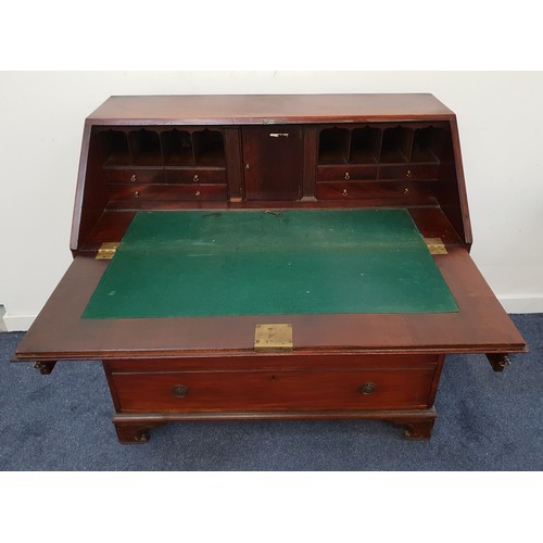 587 - GEORGE III MAHOGANY BUREAU
with a baize lined fall flap and a fitted interior of a cupboard, pigeon ... 