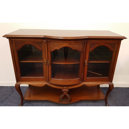 590 - EDWARDIAN MAHOGANY LOWER SECTION OF A SIDE CABINET
with a moulded bow top above three glass panelled... 