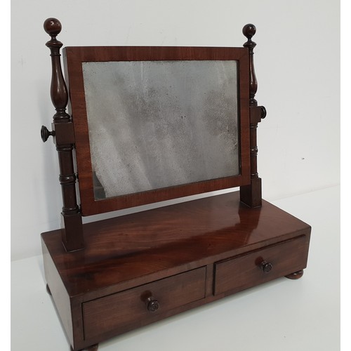 600 - GEORGIAN MAHOGANY TOILET MIRROR
with a rectangular plate supported by turned columns above a base wi... 