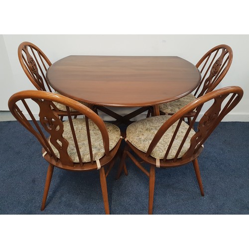 634 - ERCOL ELM DINING TABLE AND CHAIRS
the table with shaped drop flaps and standing on plain supports un... 