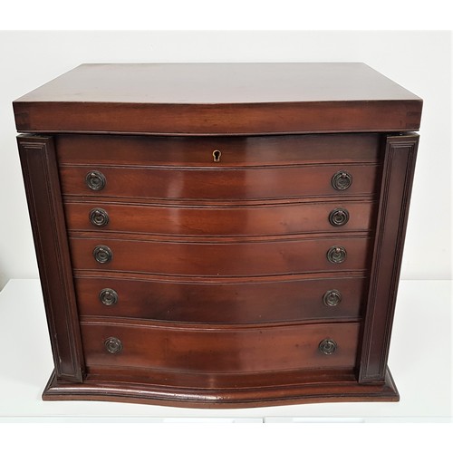 378 - MAHOGANY CANTEEN OF CUTLERY
with a serpentine lift up lid above five graduated drawers with a part O... 