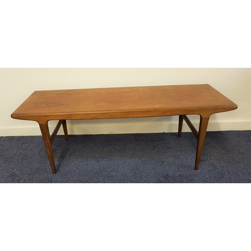 523 - TEAK OCCASIONAL TABLE
with an oblong top standing on tapering supports, 137cm long