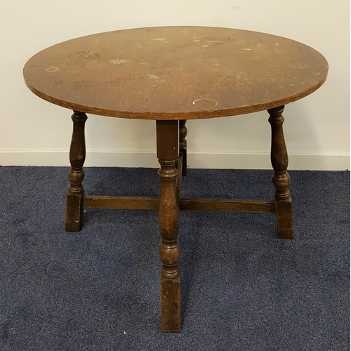 574 - OAK CIRCULAR KITCHEN TABLE
standing on turned supports united by a stretcher, 76cm high