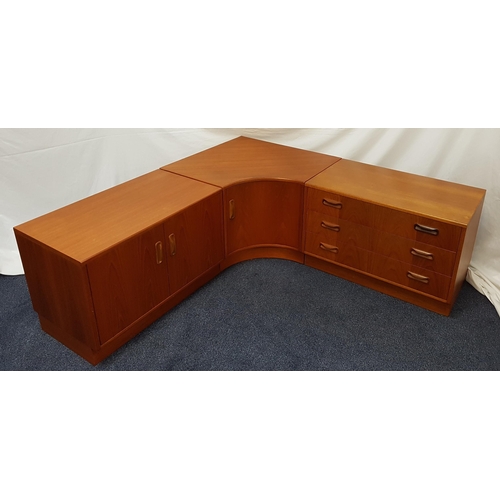 586 - G PLAN TEAK LOW SIDE CABINET
with a chest of three drawers, a two door cupboard and a central shaped... 