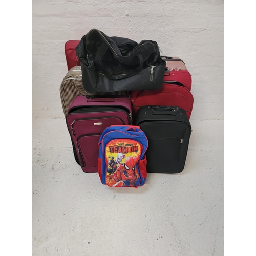 3 - SELECTION OF SIX SUITCASES AND ONE HOLDALL AND ONE RUCKSACK 
including Travel Land, Carlton, Lumi, I... 