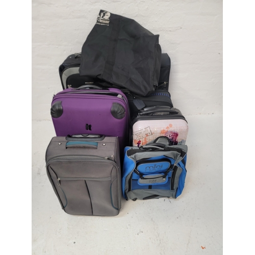5 - SELECTION OF SEVEN SUITCASES, ONE HOLDALL AND ONE RUCKSACK 
including IT Luggage, Chicane, Air case ... 