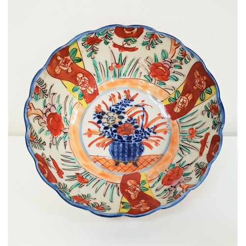 JAPANESE IMARI BOWL
with a wavy rim and decorated with flowers, 18.5cm diameter