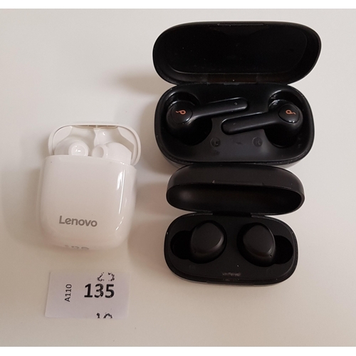 135 - THREE PAIRS OF EARBUDS IN CHARGING CASES
comprising Soundcore, Tozo and Lenovo (case hinge damaged)