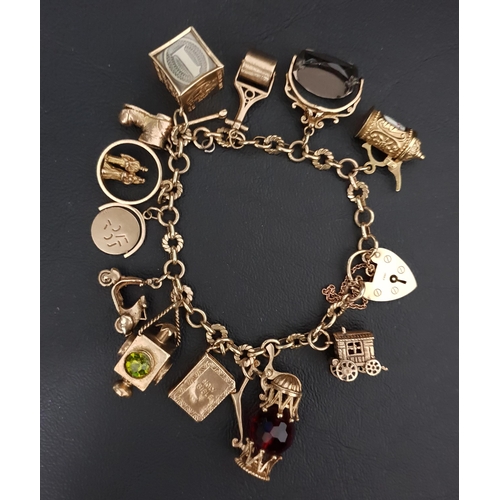 182 - GOOD NINE CARAT CHARM BRACELET
with heart padlock clasp and an interesting selection of gold charms,... 