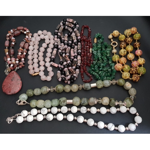 97 - SELECTION OF EIGHT GEM AND STONE SET NECKLACES
including a rough cut emerald bead necklace and other... 