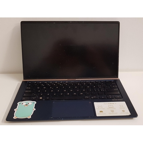 125 - ASUS ZENBOOK 14 LAPTOP
model UX433F; serial number JCN0CV11X673516; a few minor dents to bottom of t... 