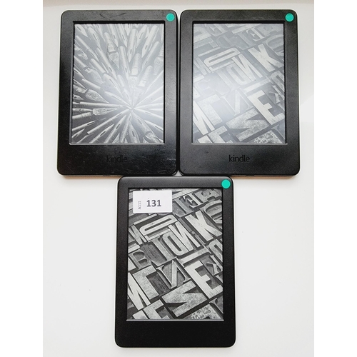 131 - THREE AMAZON KINDLE E-READERS
comprising two Kindle Basic 7th generation, serial numbers 90C6 0706 5... 