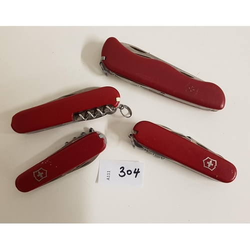 304 - FOUR VICTORINOX SWISS ARMY KNIVES
of various sizes 
Note: You must be over the age of 18 to bid on t... 