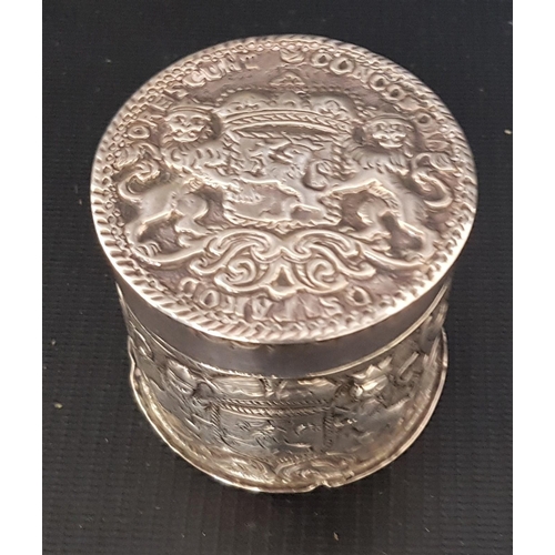 217 - VICTORIAN SILVER CYLINDRICAL LIDDED BOX
with embossed decoration and lions rampant, London 1892 to t... 