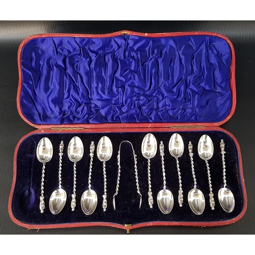 219 - SET OF ELEVEN CASED VICTORIAN SILVER APOSTLE SPOONS
with twisted stems and a pair of matching sugar ... 