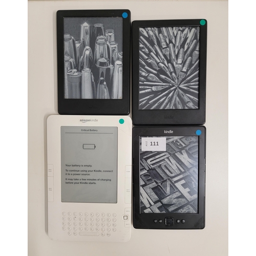 111 - FOUR AMAZON KINDLE E-READERS
comprising Kindle 4 No Touch, serial number B023 1701 2346 0DGC0; Kindl... 