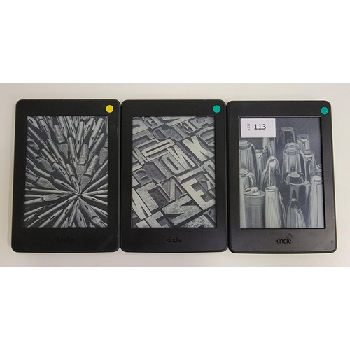 113 - THREE AMAZON KINDLE E-READERS
comprising Paperwhite 3, serial number G090 G105 5274 051D; Paperwhite... 