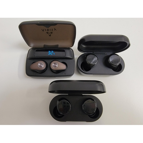 77 - THREE PAIRS OF EARBUDS IN CHARGING CASES
comprising Arbily True Wireless Earbuds and two pairs of To... 